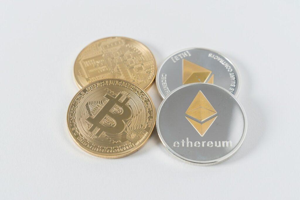 four round silver-colored and gold-colored Bitcoins