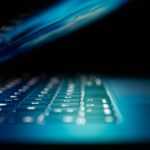 closeup photo of turned-on blue and white laptop computer